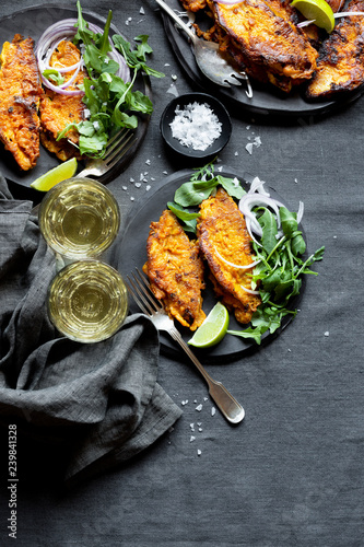 Overhead view of fried fish served on plate photo