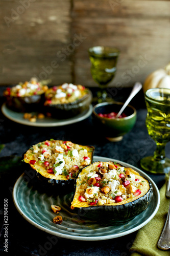 Quinoa stuffed in acorn squash served on plate photo