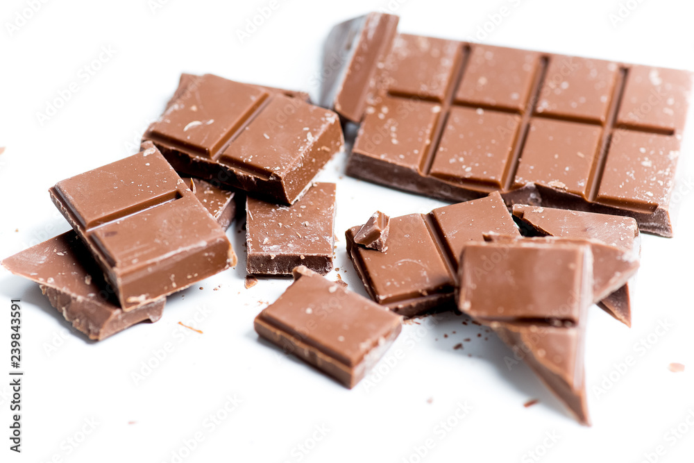 chocolate bar, shavings and cookies on a table chocolate bar, shavings and cookies on a table