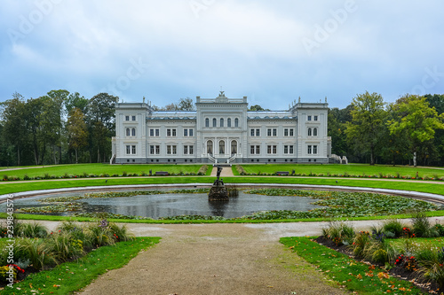 Manor house, palace with park of Duke Oginskis in Plunge, Lithuania. Plungė manor homestead in neo-renaissance style. photo