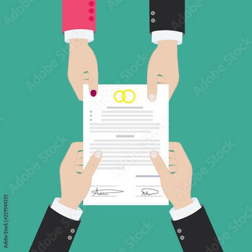 Prenuptial agreement in man and woman hands. Family and law concept