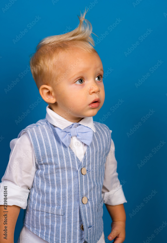 I love my hair. Little child with messy top haircut. Little child with short  haircut. Boy child with stylish blond hair. Healthy haircare tips for kids.  Haircare products Stock Photo | Adobe
