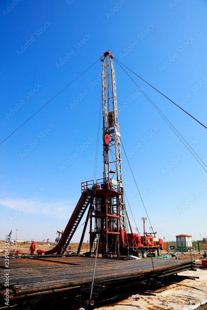 Oil drilling derrick and metal pipe