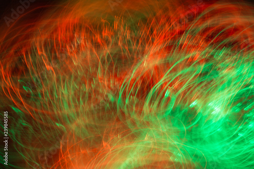 Defocused colored luminous spots and curved lines. For background