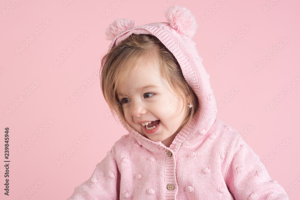 having fun. little girl child smiling. autumn and spring kid fashion. small happy girl. childhood and happiness. Hurray. Pure joy. pink background having fun. little girl child smiling. autumn and spring kid fashion. small happy girl. childhood and happiness. Hurray. Pure joy. pink background