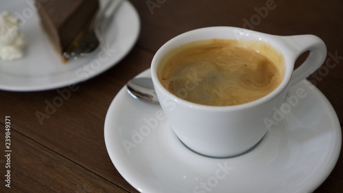 cup of coffee on wooden table 