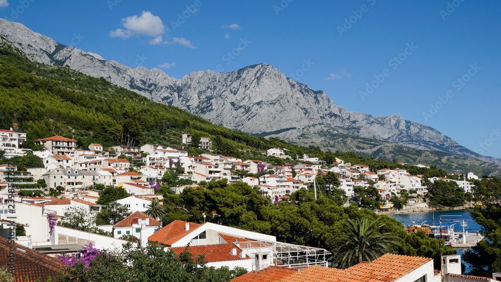 Cityscape of the beautiful Croatian town, Brela situated on the Dalmatian Coast at the base of the Biokovo mountain. Charming village at the Adriatic Sea.
