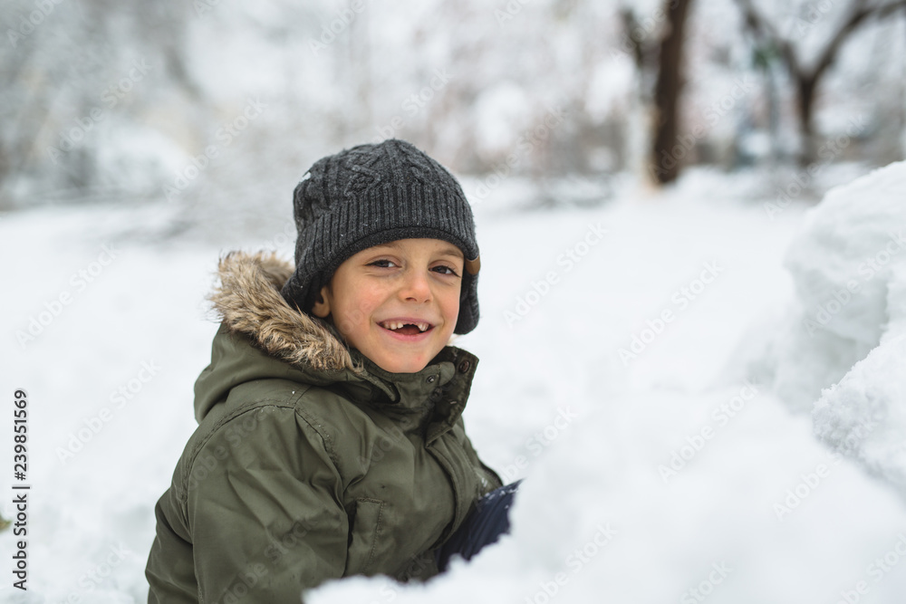 portrait of happy boy playing outdoor in snow portrait of happy boy playing outdoor in snow