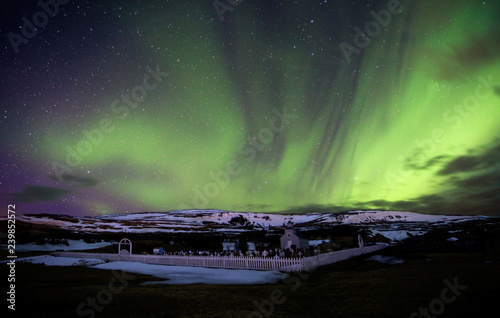 Northern Lights over Small Church in Iceland in Winter