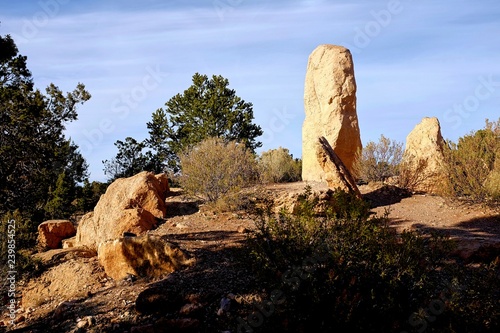 Large Rock formations come up from the ground, creating a western scene