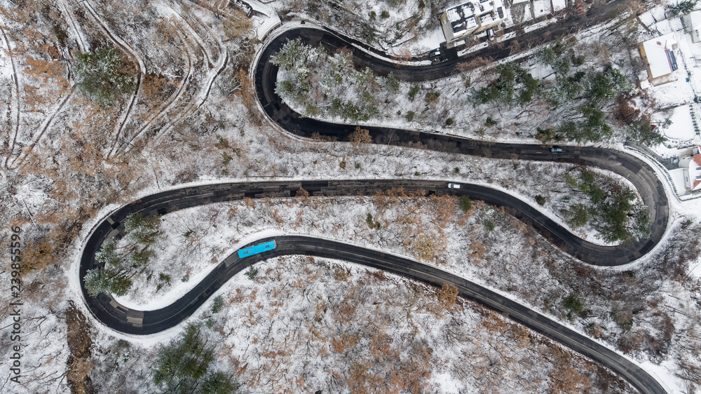 Fototapeta premium Aerial view of curvy road in Mecsek forest