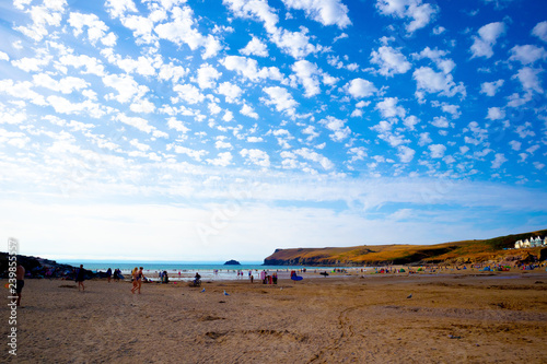 view of beach with blue sky and clouds