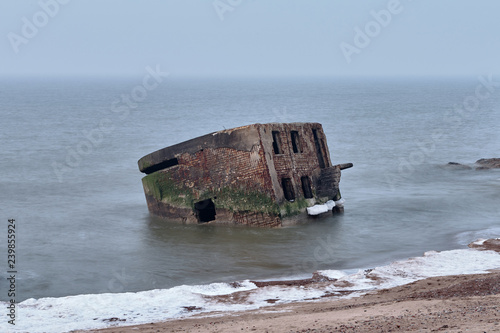 Fototapeta Naklejka Na Ścianę i Meble -  Ruins of Northern Forts on the beach of the Baltic sea, part of an old fort in the former Soviet base Karosta in Liepaja, Latvia