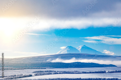 winter landscape with mountains and clouds © slayer87