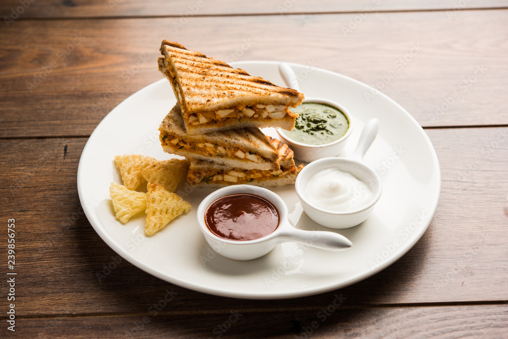 Paneer tikka Sandwich - is a popular Indian version of sandwich using cottage cheese curry with tomato ketchup, mint chutney Paneer tikka Sandwich - is a popular Indian version of sandwich using cottage cheese curry with tomato ketchup, mint chutney