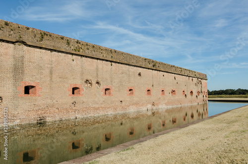 Bullet holes / cannon holes in the brick walls of Fort Pulaski National Monument in Georgia from the Civil War photo