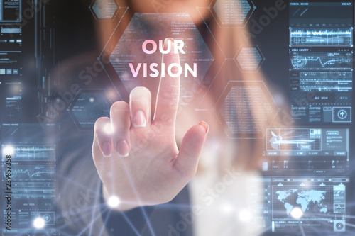 The concept of business, technology, the Internet and the network. A young entrepreneur working on a virtual screen of the future and sees the inscription: Our vision