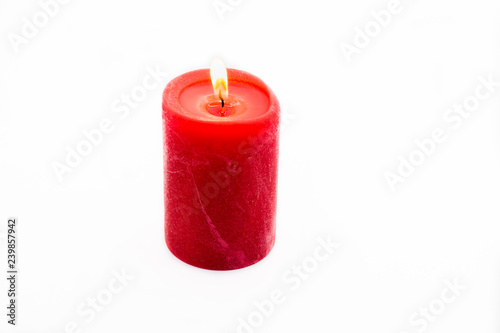 Red candle isolated on white background