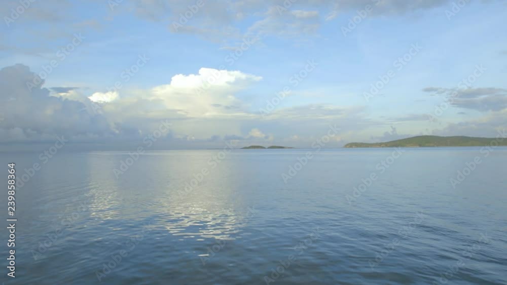 Panoramic shot starting from sea and ending on a fishing village on beach Panoramic shot starting from sea and ending on a fishing village on beach
