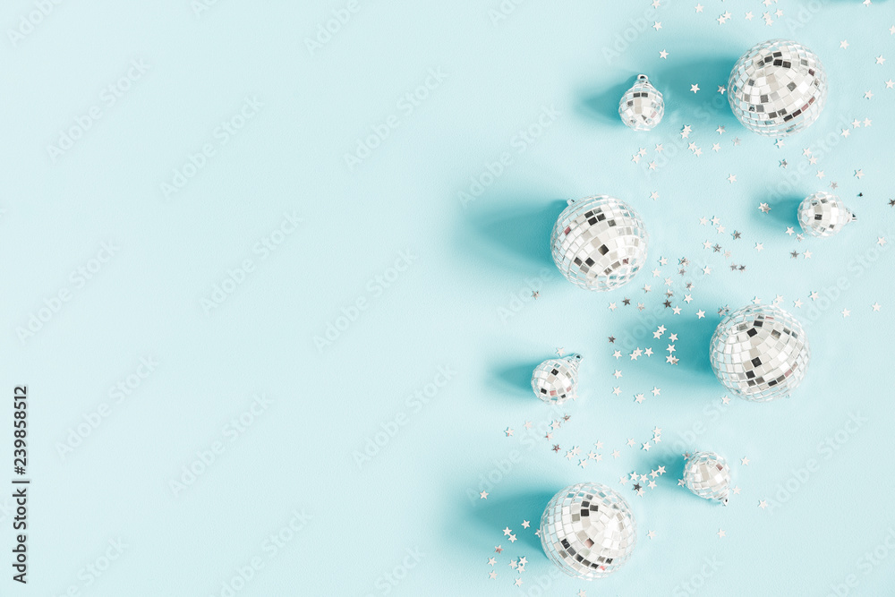 Christmas composition. Frame made of disco balls on pastel blue background. Christmas, winter, new year concept. Flat lay, top view, copy space Christmas composition. Frame made of disco balls on pastel blue background. Christmas, winter, new year concept. Flat lay, top view, copy space