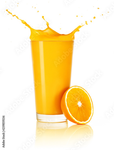 orange juice with splash and half fruit isolated on white