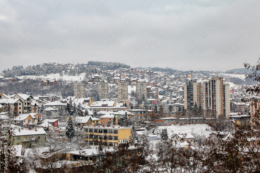 Uzice town in Serbia covered with snow. Cloudy winter day