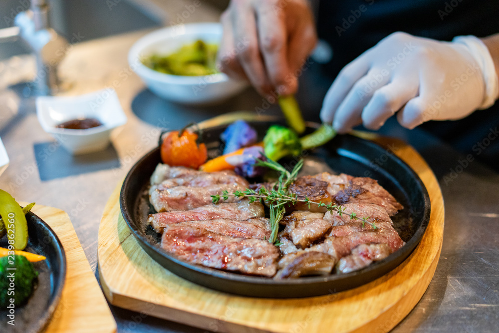 sirloin steak cooking with chef. sirloin steak cooking with chef.