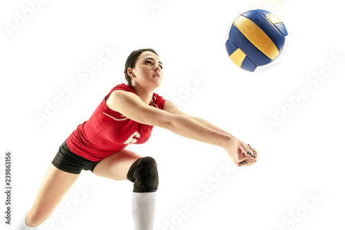 Female professional volleyball player isolated on white with ball. The athlete, exercise, action, sport, healthy lifestyle, training, fitness concept