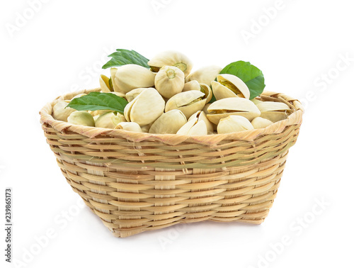 Pistachio in basket isolated on white background.