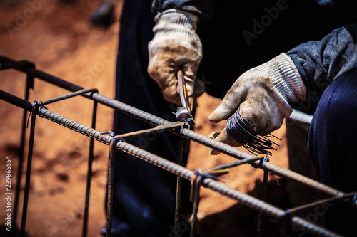 Billede på lærred Industry construction site labor people worker wire steel bar