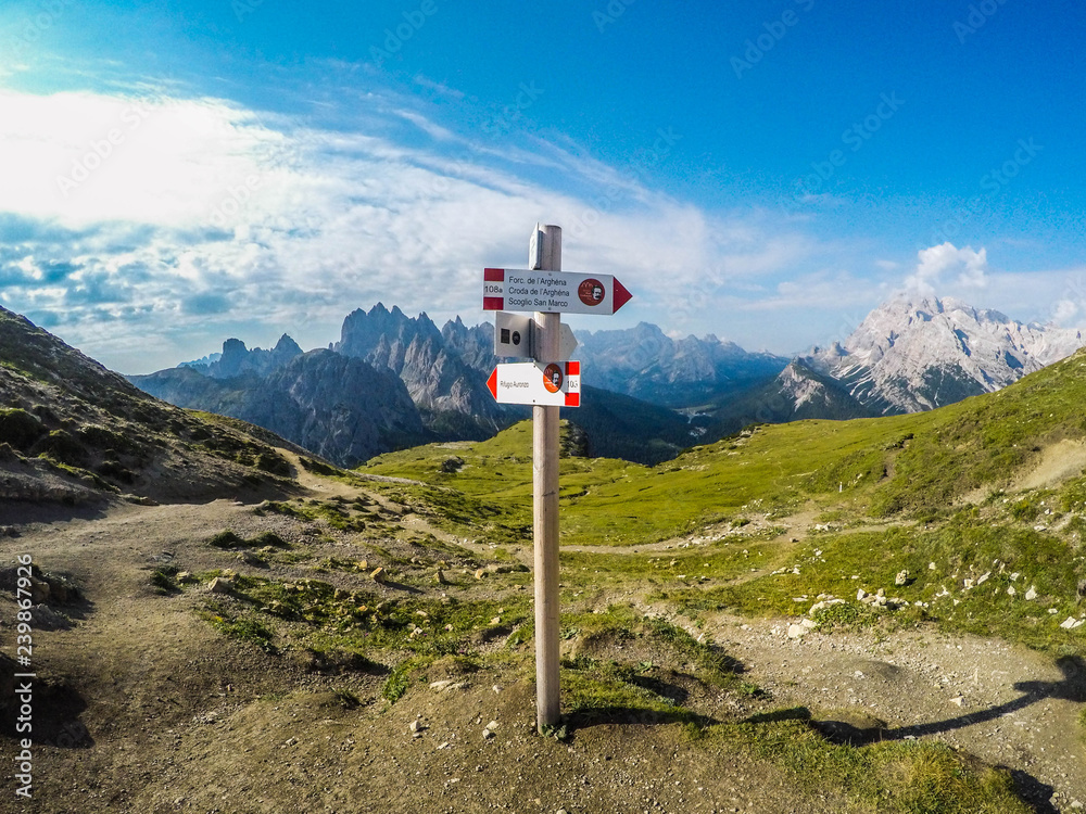 Breathtaking mountain landscape view of iconic Tre Cime di Lavaredo walking trail or Drei Zinnen, Sexten Dolomites, Italy in summer. Tourist popular spectacular attraction/destination in Europe