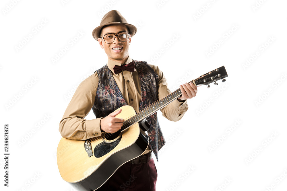 happy mixed race male musician in hat and eyeglasses playing on acoustic guitar isolated on white happy mixed race male musician in hat and eyeglasses playing on acoustic guitar isolated on white