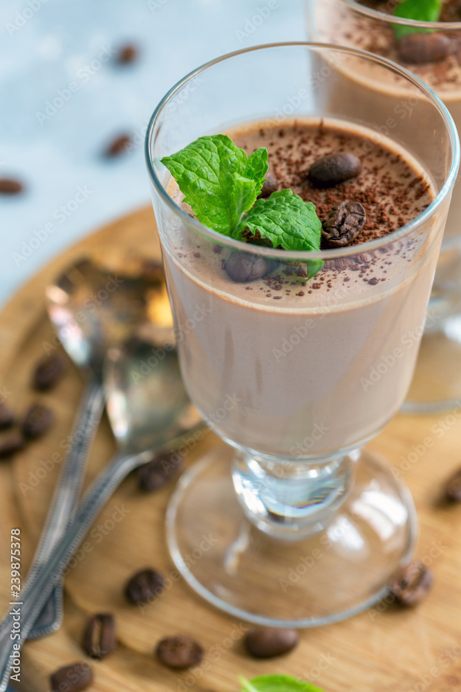 Coffee Panna cotta with a sprig of mint in the glass. Coffee Panna cotta with a sprig of mint in the glass.