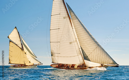 Sailing yacht race regatta. Classic sailboats in the sea under sail. Yachting sport and travel 