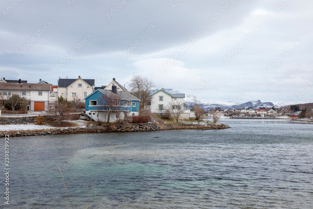 Fototapeta premium Houses on the shoreside of Bronnoysund city Northern Norway