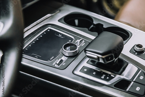 touch panel in a premium car. Management of multimedia functions, and options of the car, navigation, music. Cup holders and gear lever. © Dmitry Dven