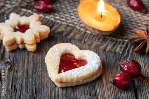 Linzer Christmas cookies on a rustic background