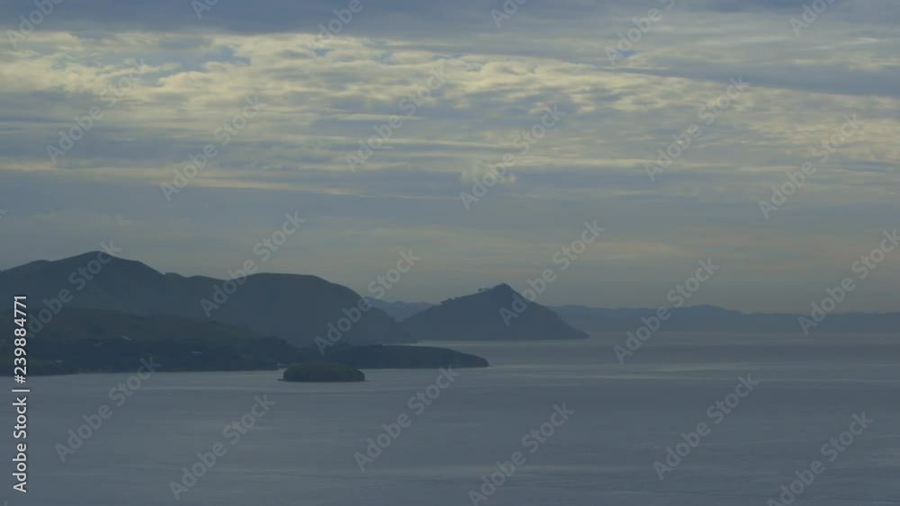 Wide still late evening shot of Moresby coastal Islands silhouettes, Papua New Guinea. Wide still late evening shot of Moresby coastal Islands silhouettes, Papua New Guinea.
