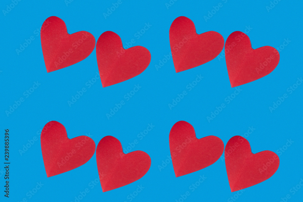 background for Valentine's day holiday, heart on blue background, couple of hearts on red and blue background