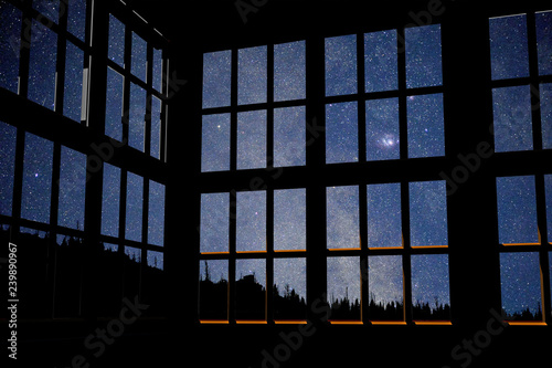3d computer rendered illustration of windows over a photo I took of the milky way