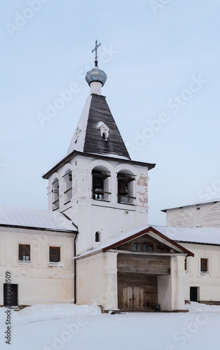 Bell tower of ancient russian monastery in winter time