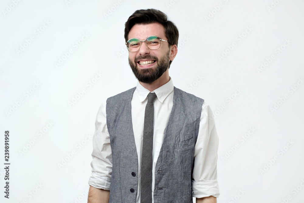 Young handsome business man over isolated background happy face smiling and looking at the camera. Positive person. Young handsome business man over isolated background happy face smiling and looking at the camera. Positive person.