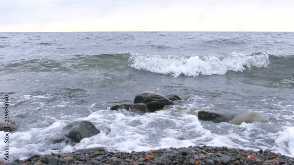 Waves on the stone beach. Waves on the stone beach.