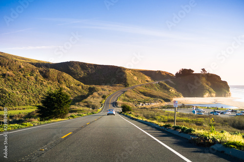 Photography Driving on Highway 1 on the Pacific Ocean coastline close to Half Moon Bay, Cali