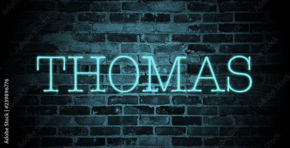 first name Thomas in blue neon on brick wall first name Thomas in blue neon on brick wall