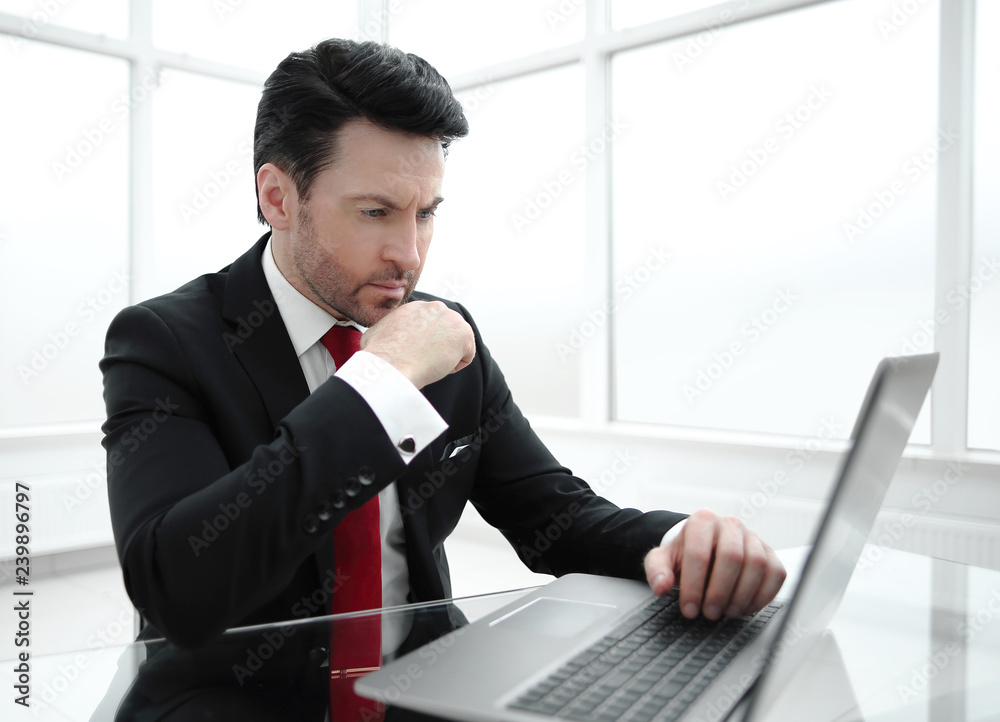 Businessman sitting at his Desk.business and technology Businessman sitting at his Desk.business and technology