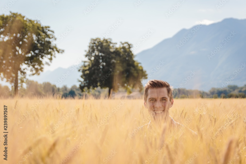 Man posing in a Wheat filed