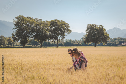 Couple enjoying outdoors in a wheat field