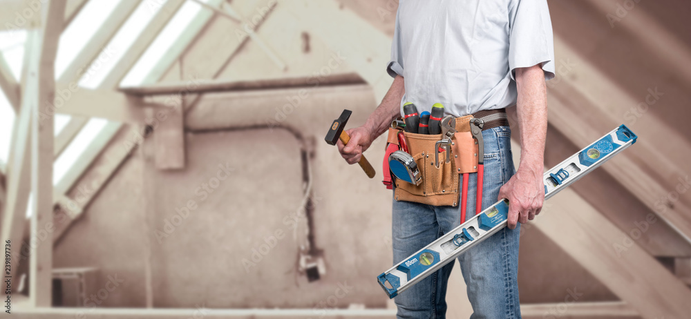 Building worker with tool belt Building worker with tool belt