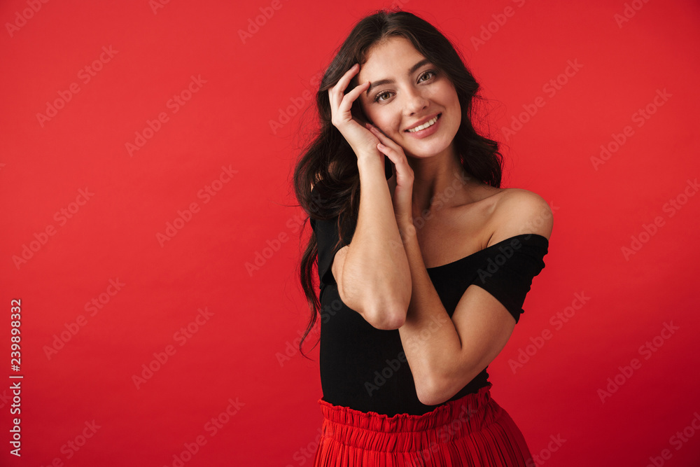 Pretty young woman wearing a dress standing Pretty young woman wearing a dress standing